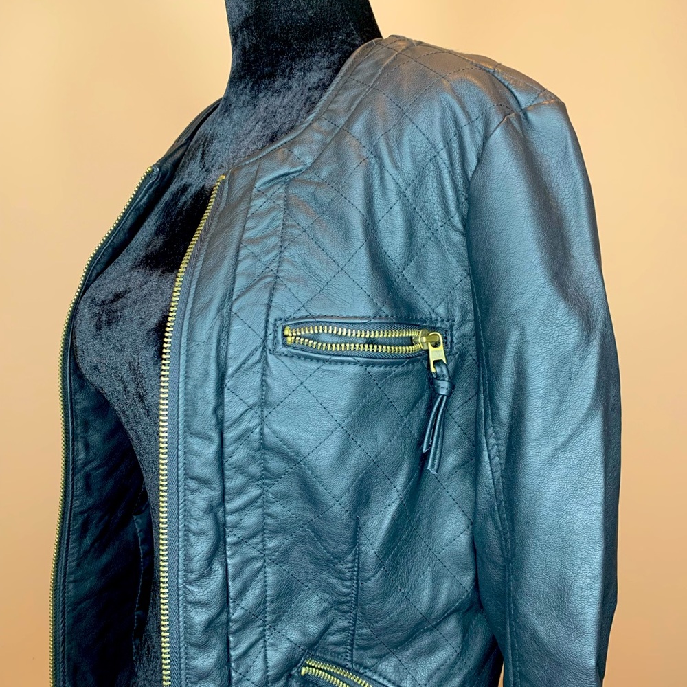 Express faded black leather jacket with gold zippers and diamond stitch detail.